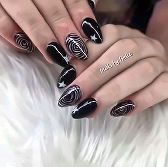 Black nails with white swirl and star art