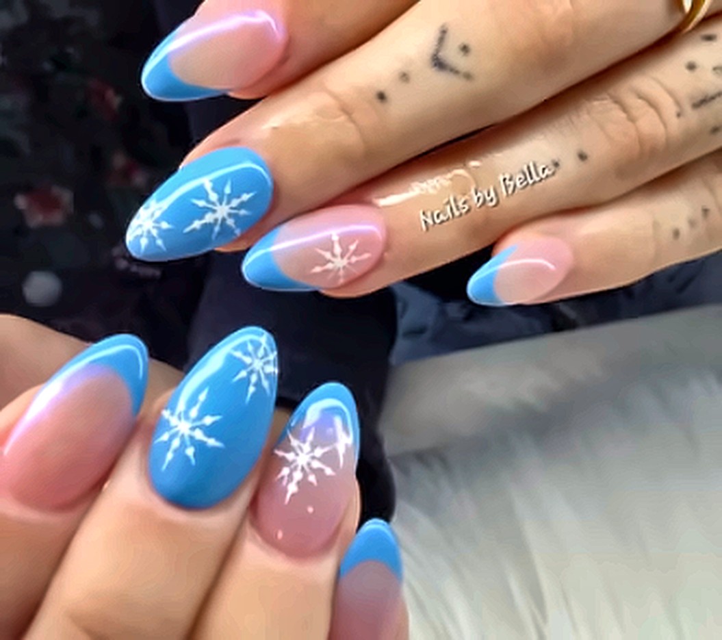 Blue French tips with white snowflakes