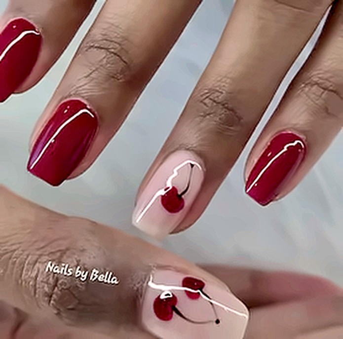 Deep red nails with a hand-painted cherry accent nail